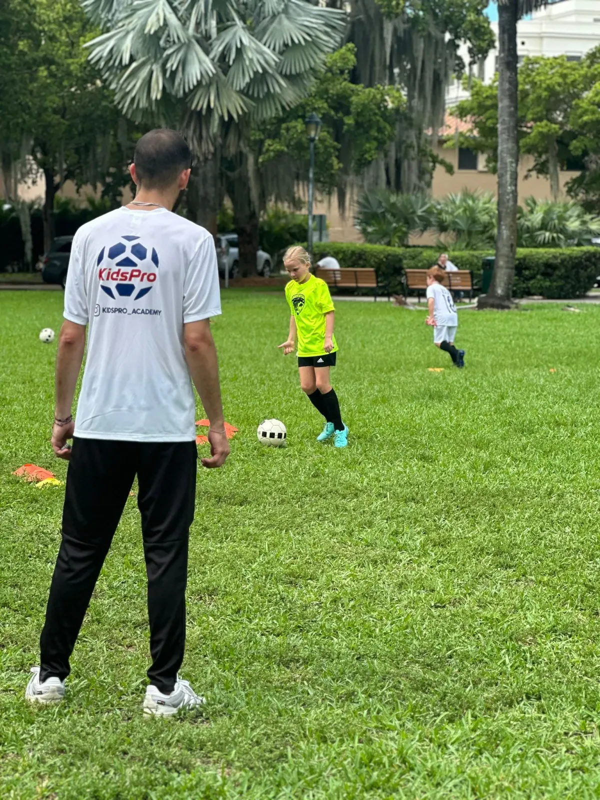 Small group soccer coaching session at KidsPro Academy Miami