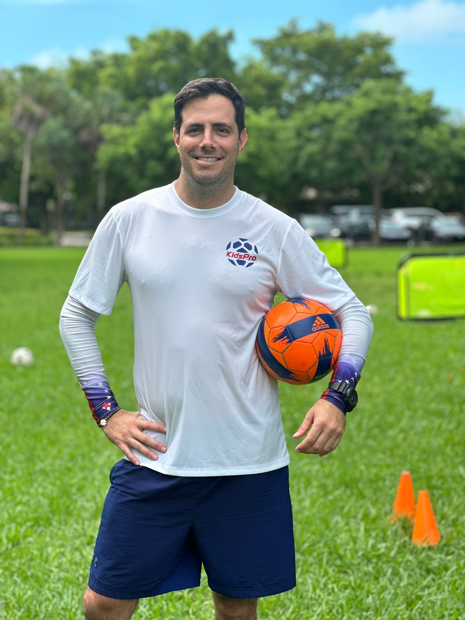 Coach Diego explaining soccer to kids