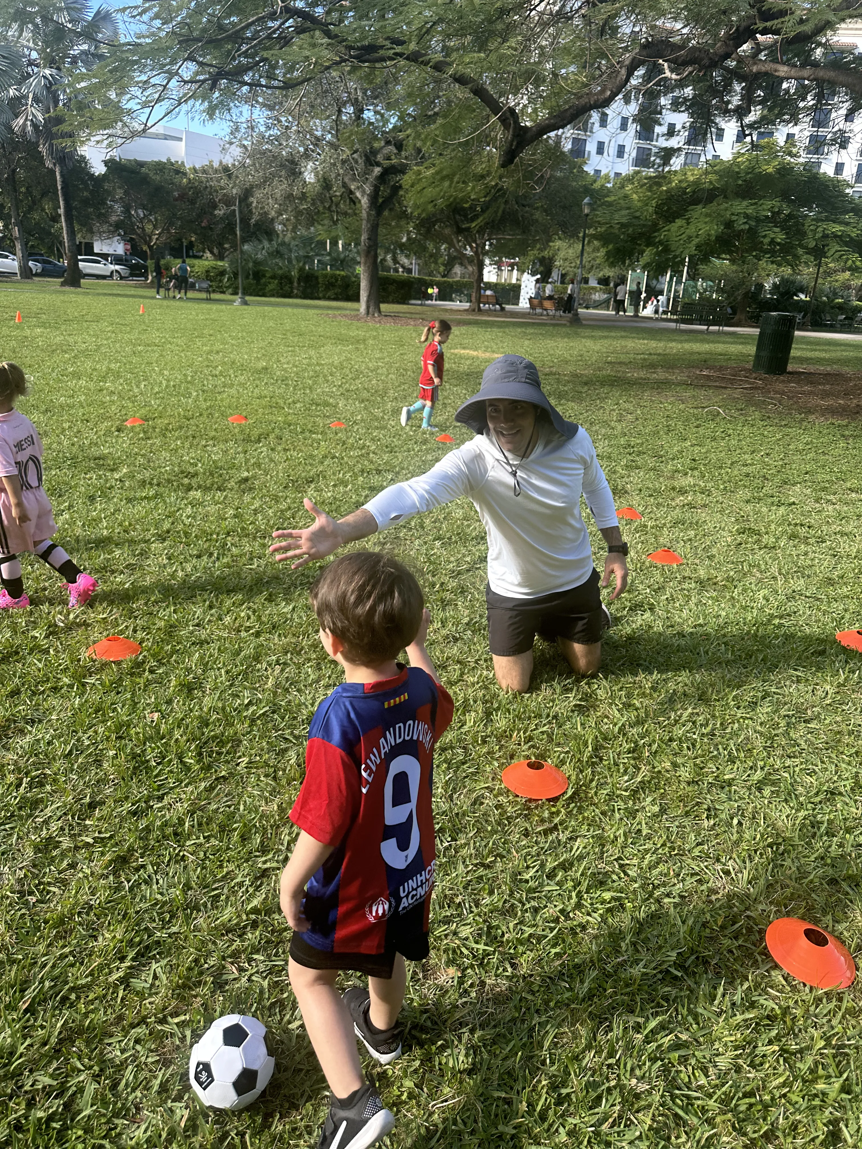 Kids playing soccer at Dante Fascell Park in South Miami